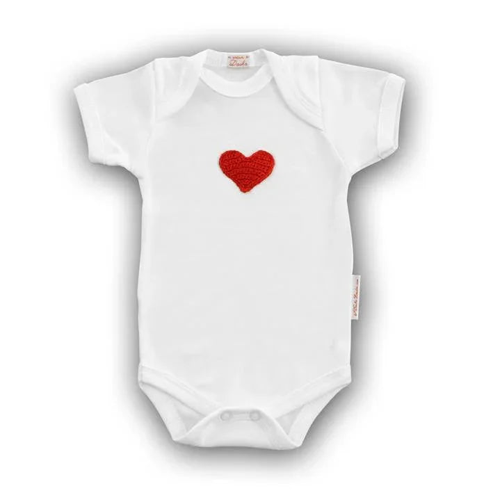 White baby onesie featuring a hand-crocheted red heart design.