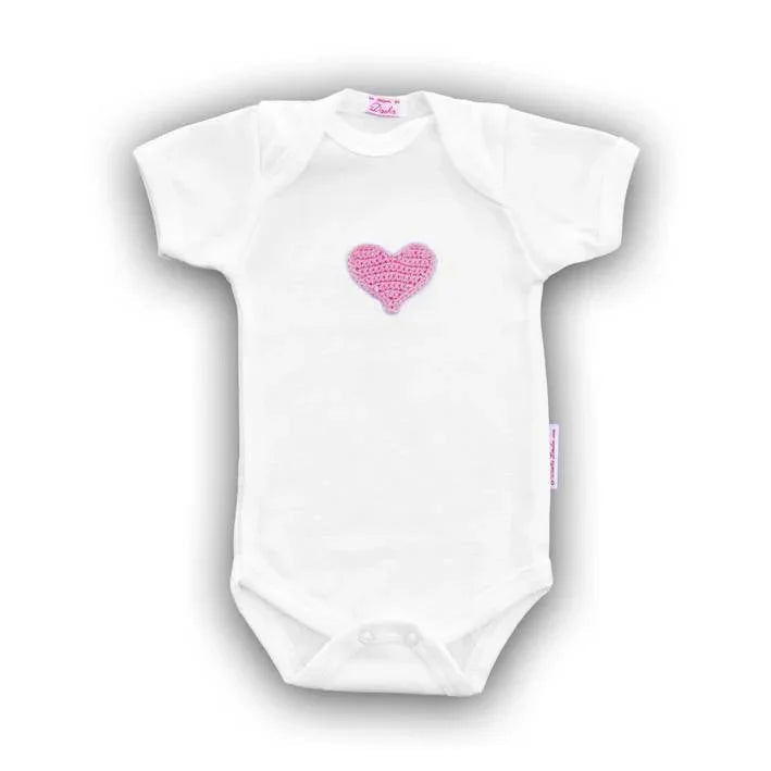White Norvella baby onesie featuring a hand-crocheted pink heart on the chest.
