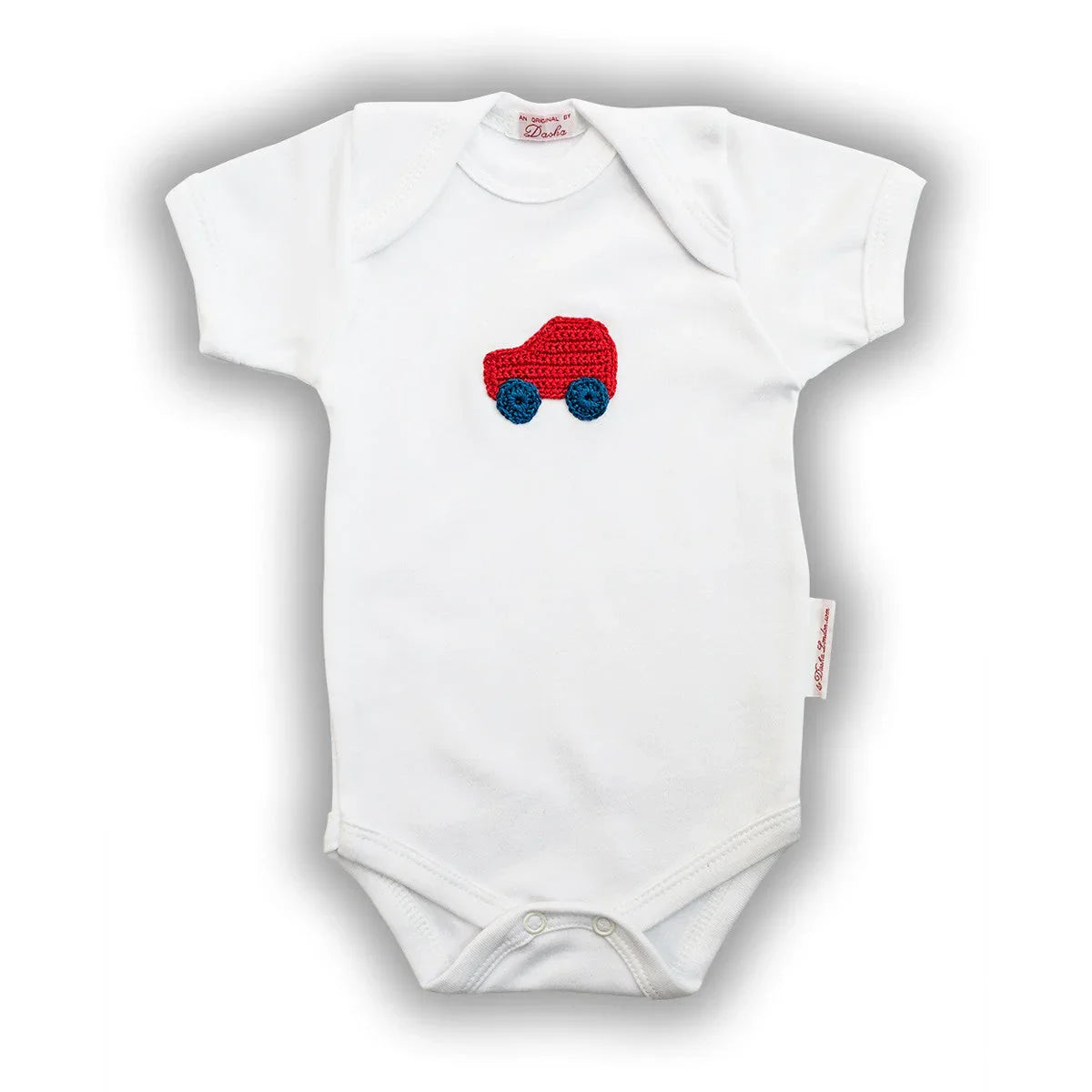 White Norvella baby onesie featuring a hand-crocheted red car design.
